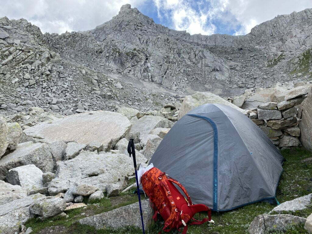 Camping tent pitched among rocky terrain on the Seven Lakes Trek in the Dhauladhar range near Dharamshala