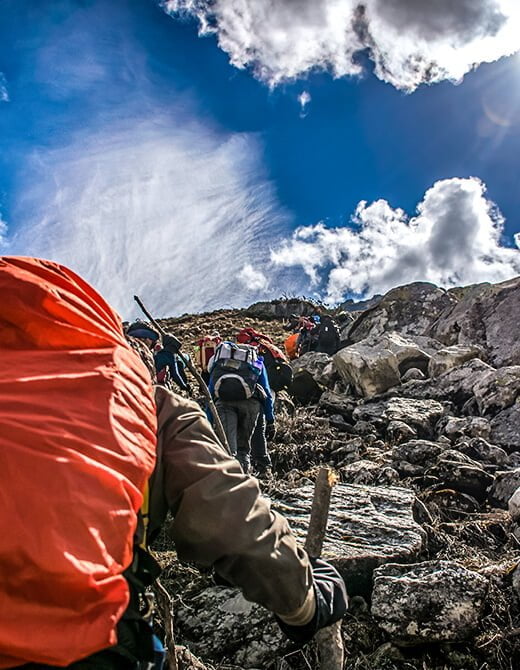 Experiences 1 Trekkers hiking on a rocky Himalayan trail during a guided adventure in India
