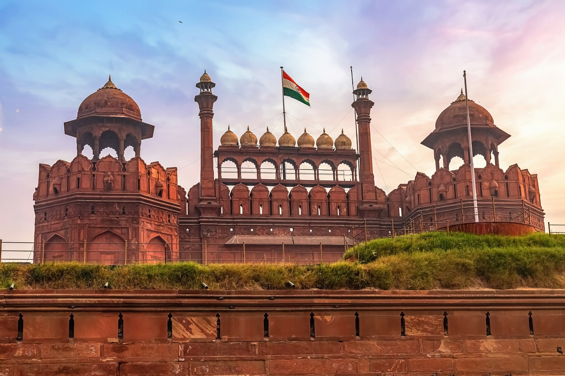 Historic Red Fort Delhi at sunrise. Red Fort is a medieval Indian architecture masterpiece designated as the UNESCO World Heritage site