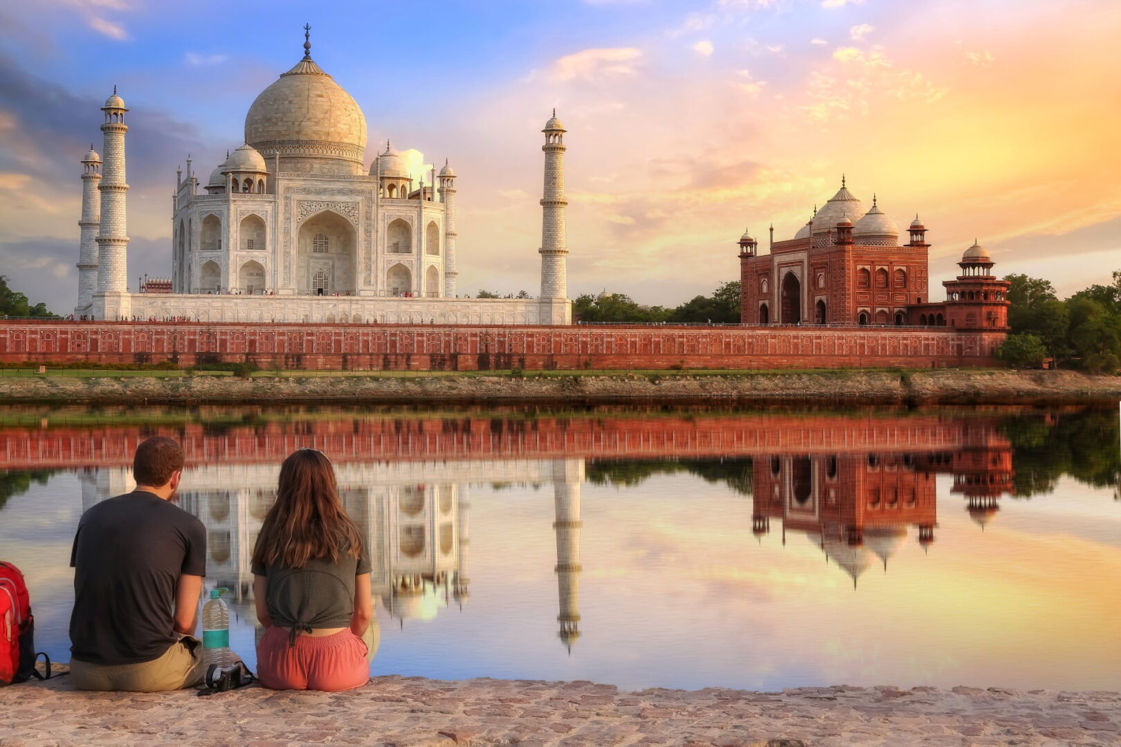 Taj Mahal at sunset reflecting in the Yamuna River, viewed from Mehtab Bagh in Agra