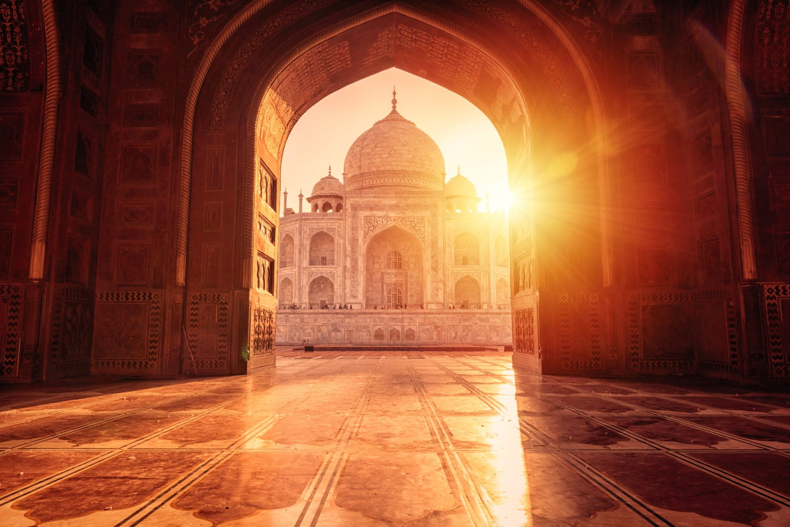 The magnificent Taj Mahal in India shows its full splendor at a glorious sunrise.