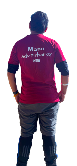 Manu Adventures India trekking guide wearing branded T-shirt in the Himalayas