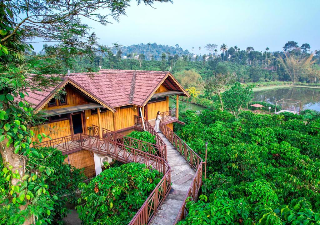 a house with a bridge over a river