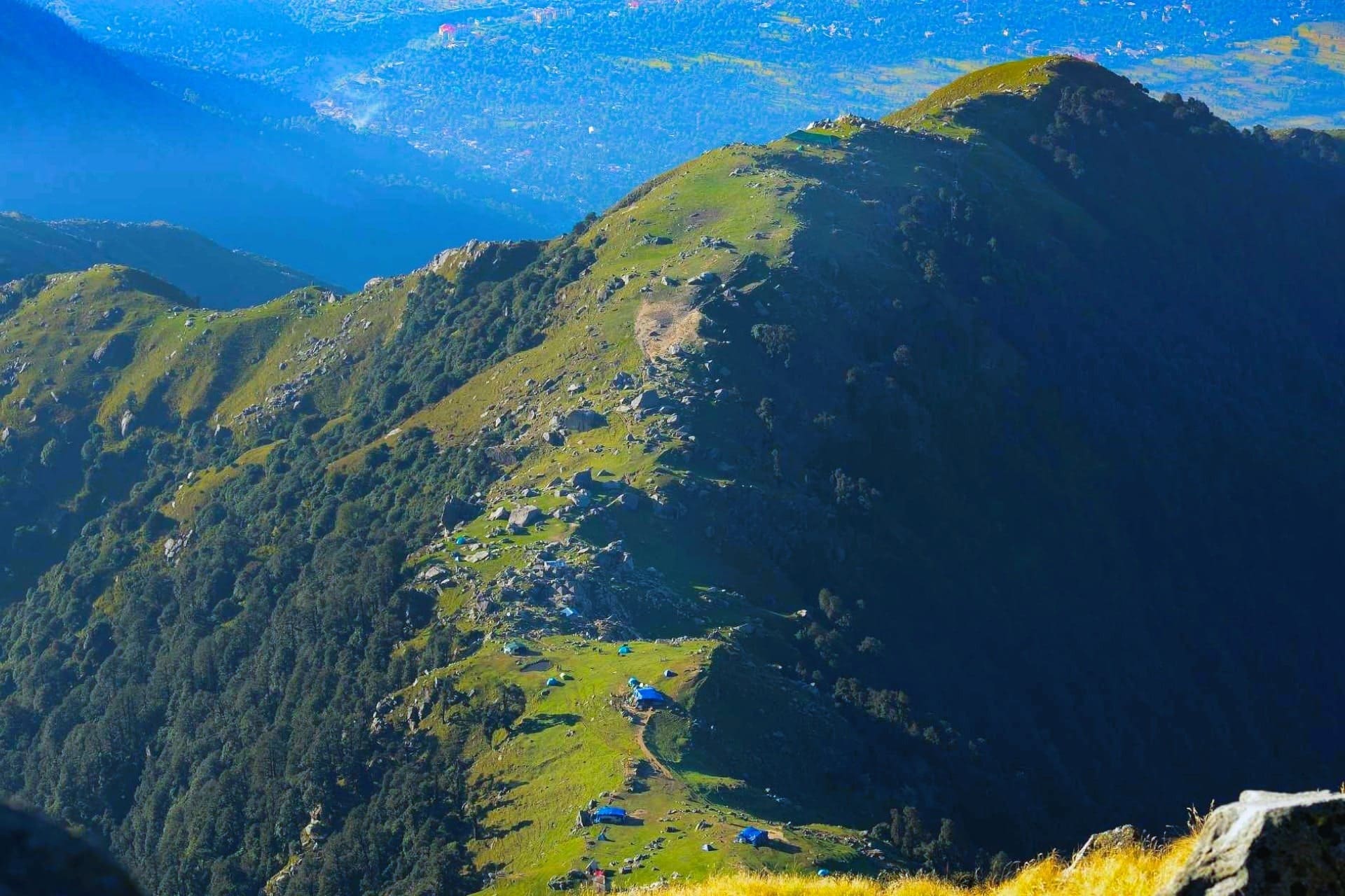 Scenic mountain ridge and green hills in Dharamshala, Himachal Pradesh, showcasing nature walks and trekking trails