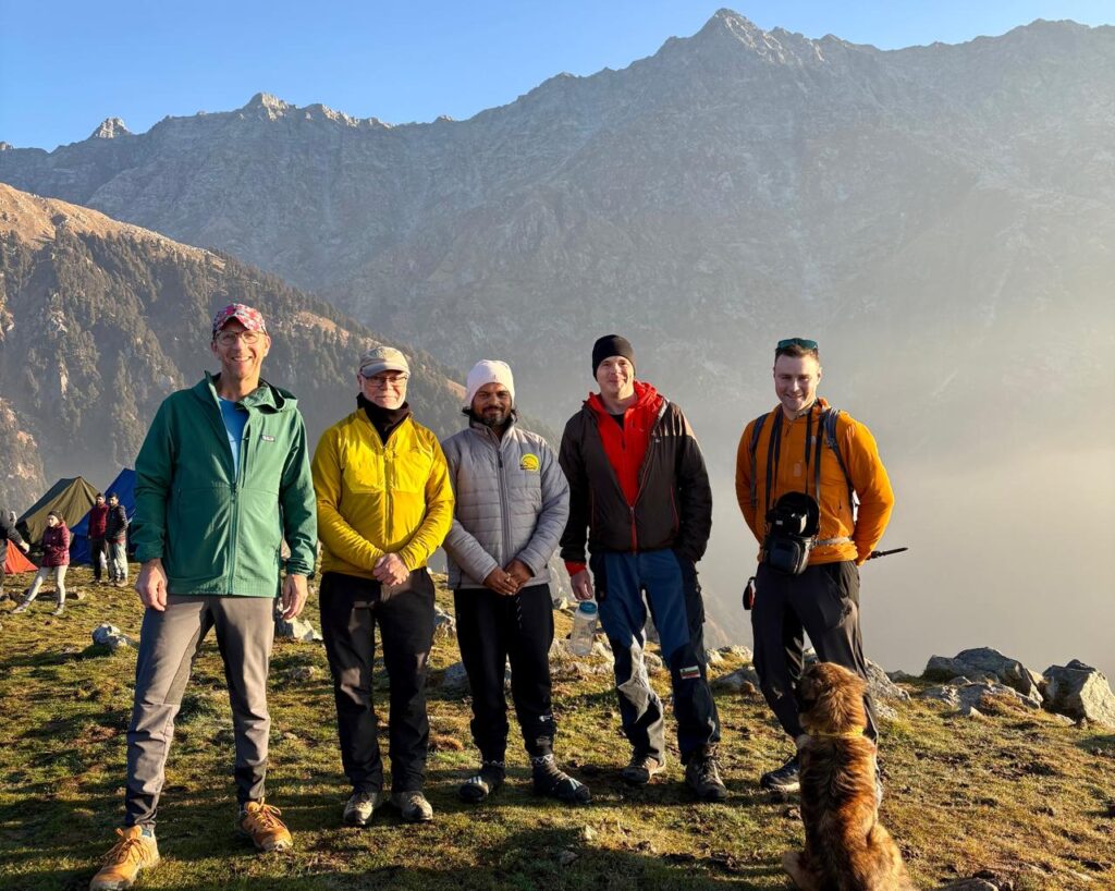 a group of people standing on a mountain