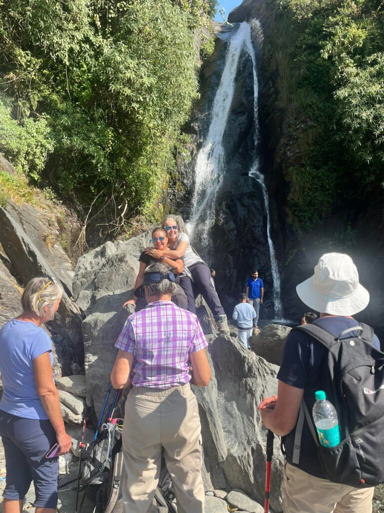 Tourists enjoying Bhagsu Waterfall near McLeod Ganj in Dharamshala, Himachal Pradesh