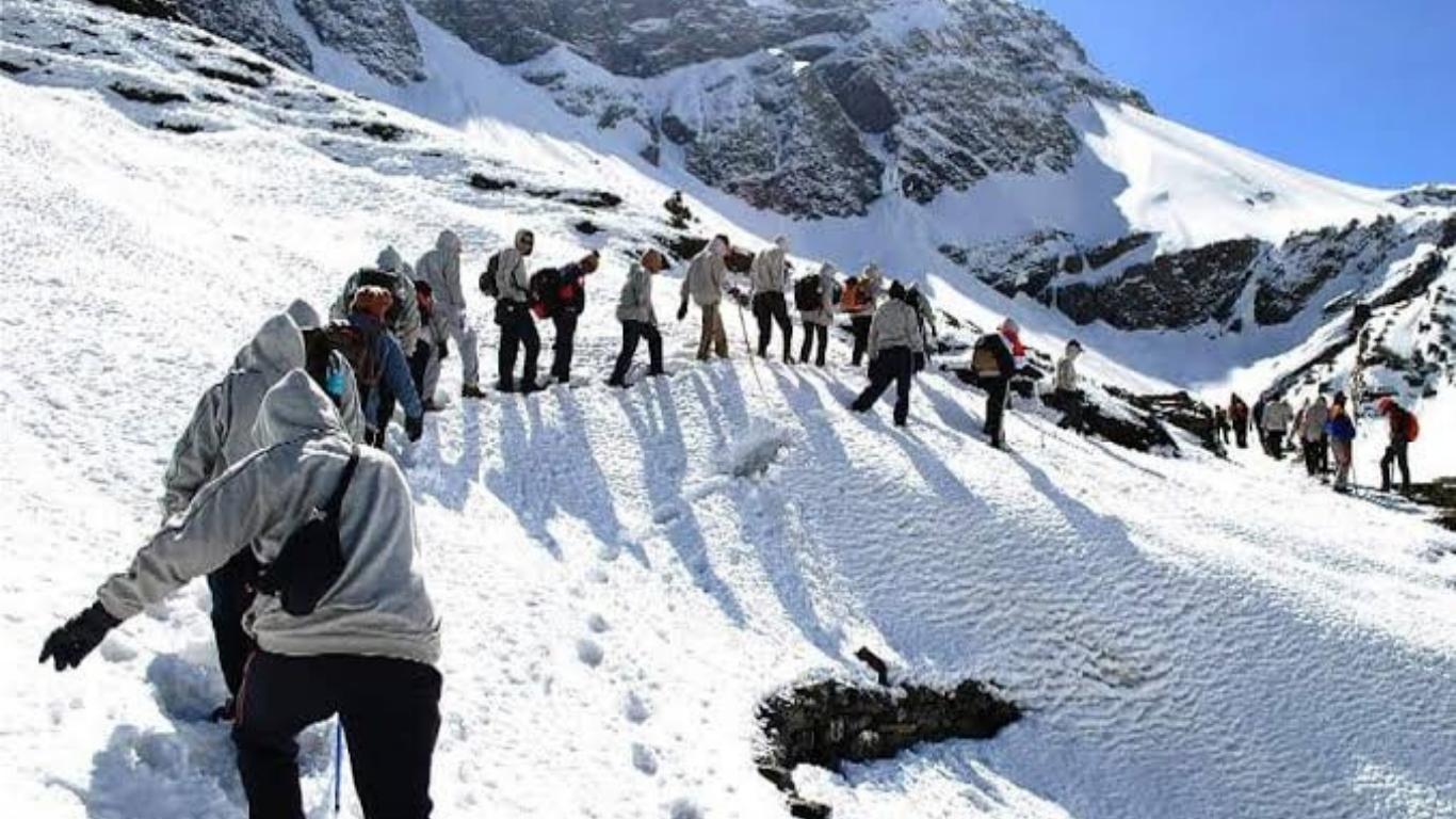 a group of people climbing a mountain