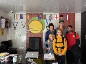 Team at Manu Adventures India posing together inside the office in Dharamshala.