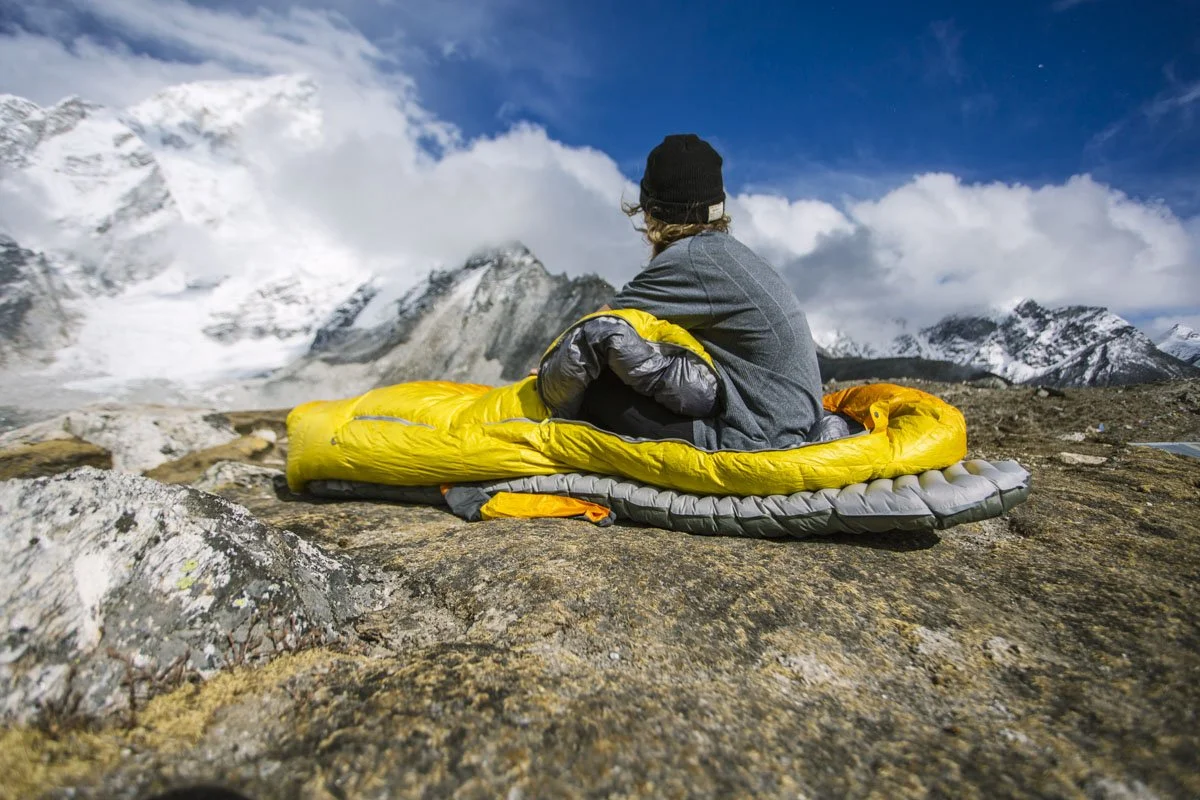 Father and child hiking together on a mountain trail, illustrating beginner-friendly trekking and family camping in the Himalayas