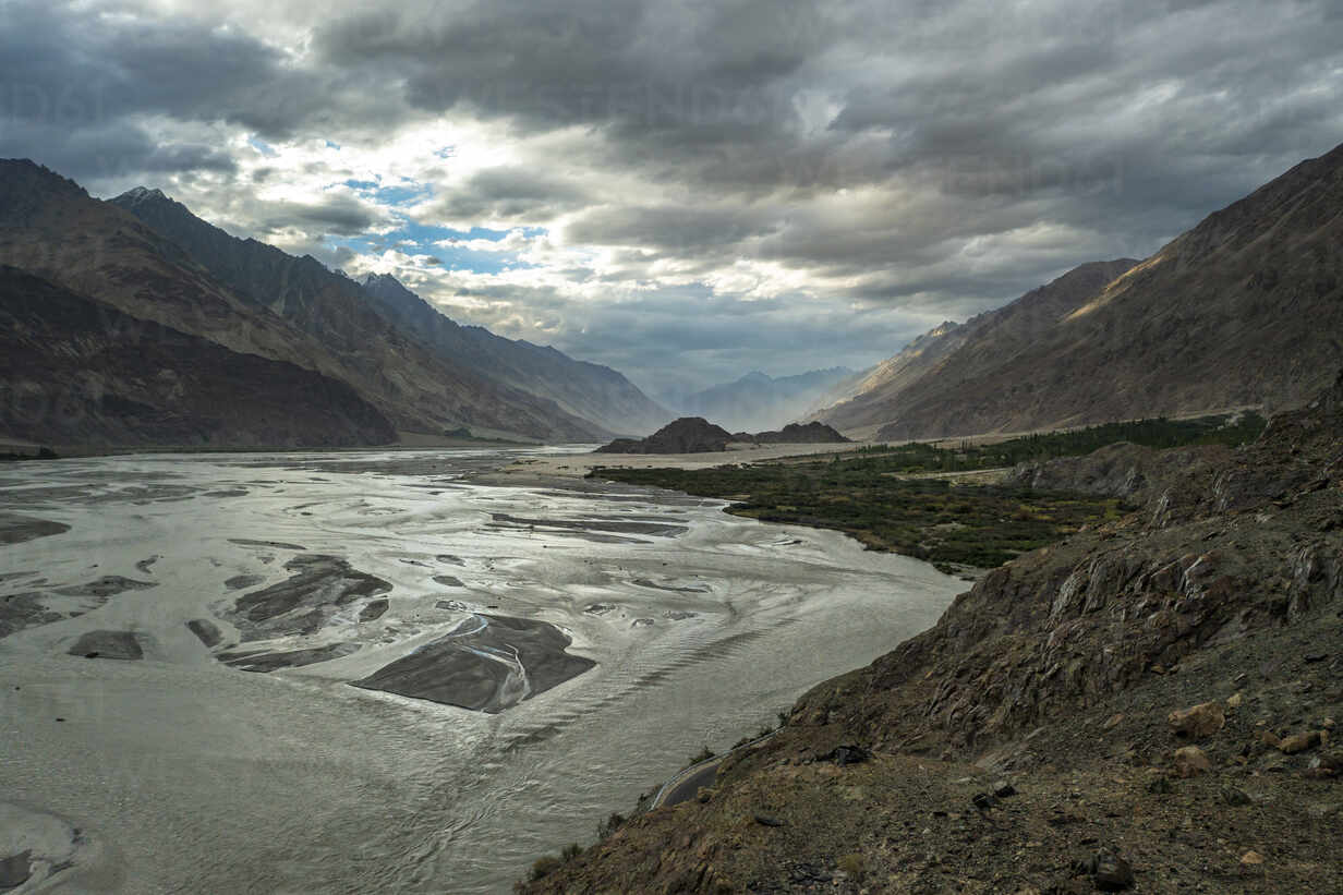 Aerial view of the Nubra River flowing through a high-altitude valley surrounded by rugged mountains in Ladakh
