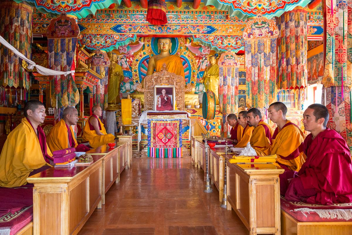 Buddhist monks praying at a monastery in Dharamshala, Himachal Pradesh